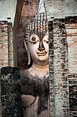 Thailand - Old Sukhothai - Wat Si Chum the roofless mondop enshrines the impressive 15 meter high seated Buddha named Phra Achana.  